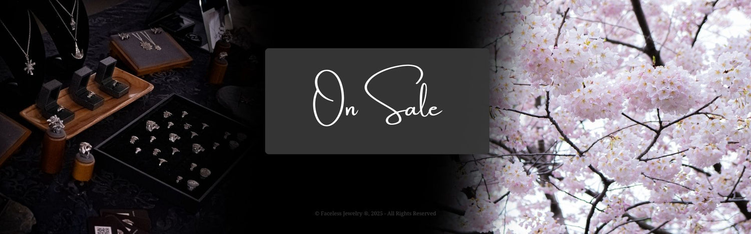 On Sale Banner Image - featuring a jewelry display table and a photograph of pink flowers to the right